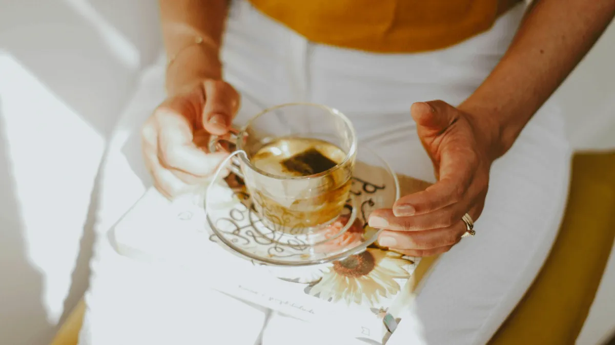 Designing a Wellness Vision: a peaceful moment with tea and a book, symbolizing intentional self-care and reflection.