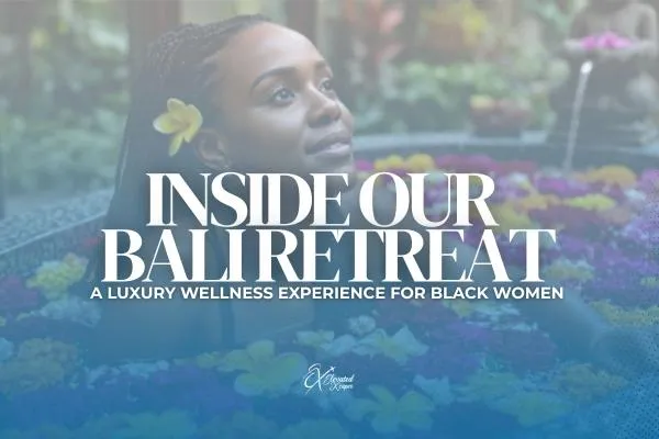 Black woman soaking in a vibrant flower bath during a luxury wellness retreat in Bali.
