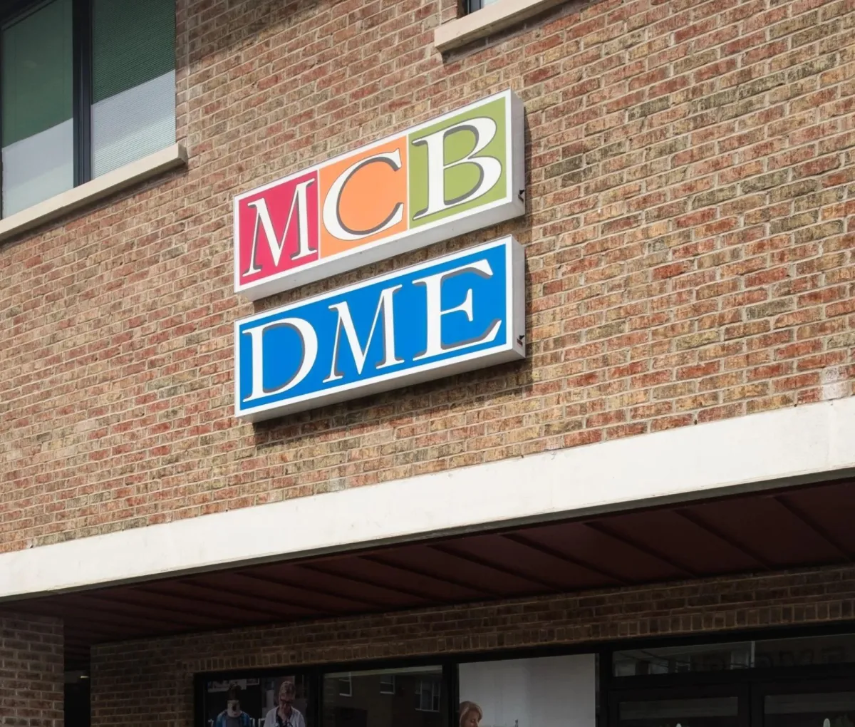 Exterior of MCB DME’s Hawthorne, NJ storefront with overlay text announcing the new availability of arterial pumps and a URL directing to www.mcbdme.com/blog
