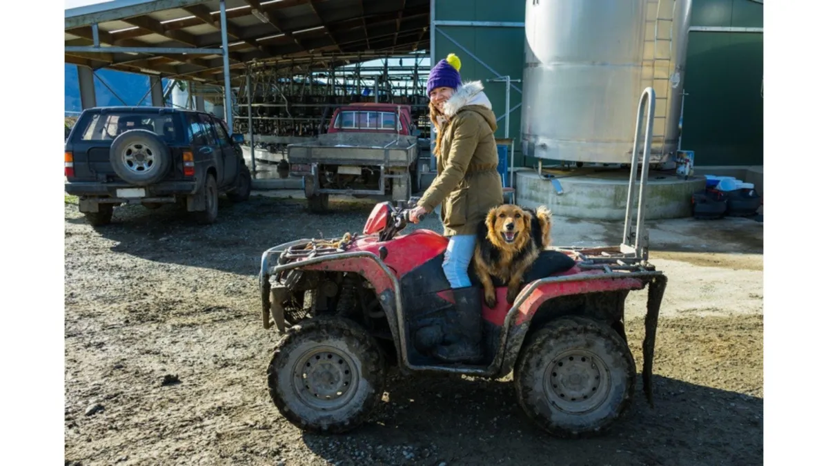 a farmer riding an ATV