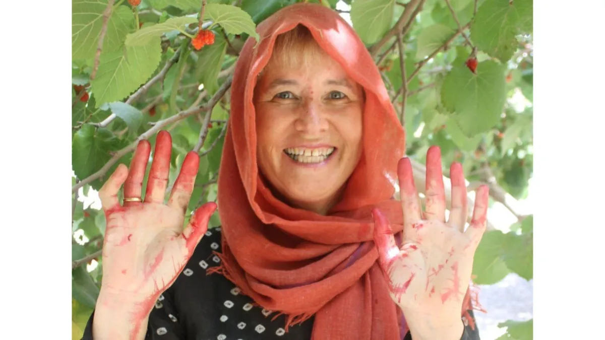 Woman with red stains on her hands