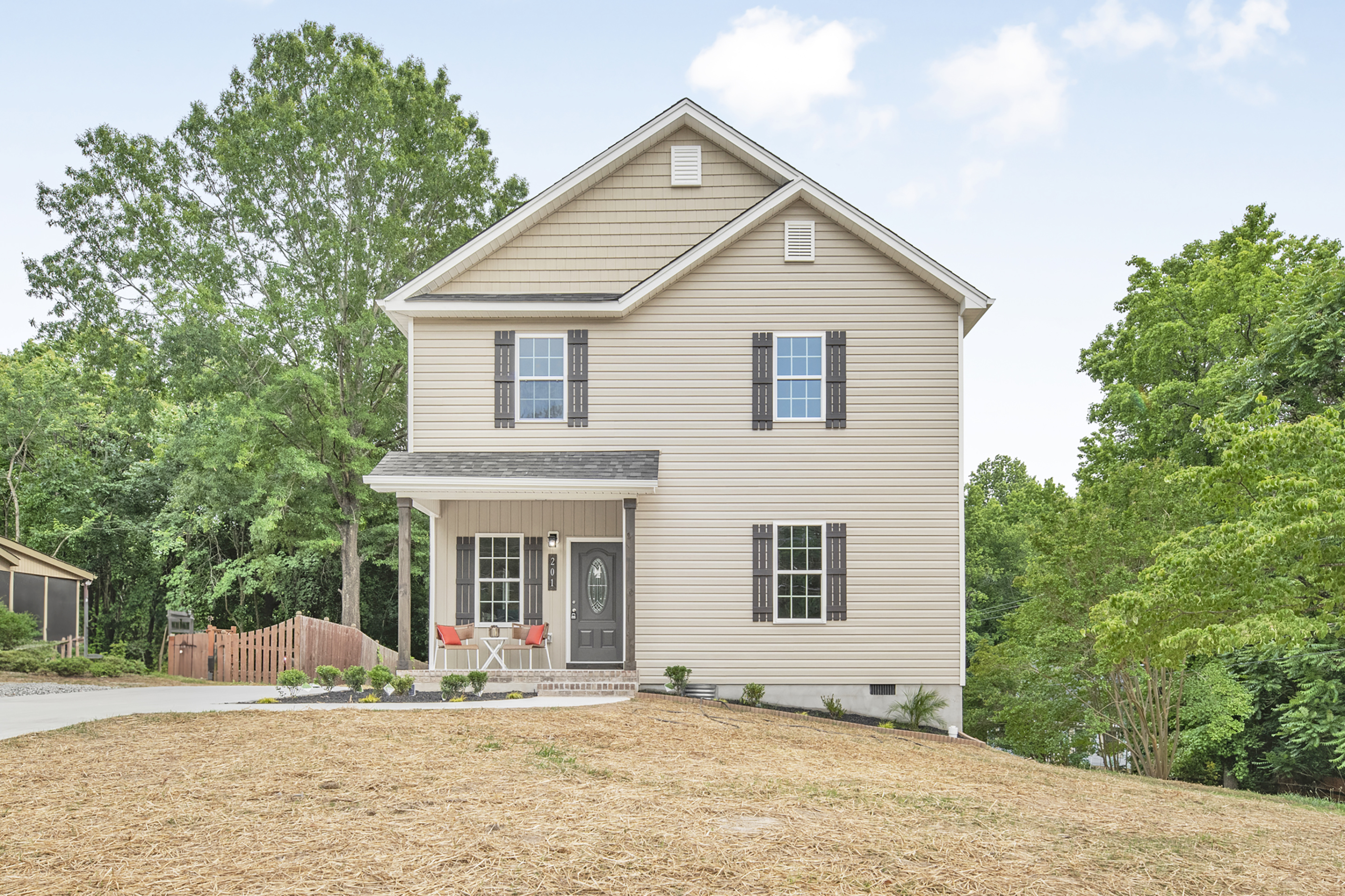 Exterior view of new 4-bedroom, 3-bath two-story home with vinyl siding and full basement in Kernersville, NC 27284.