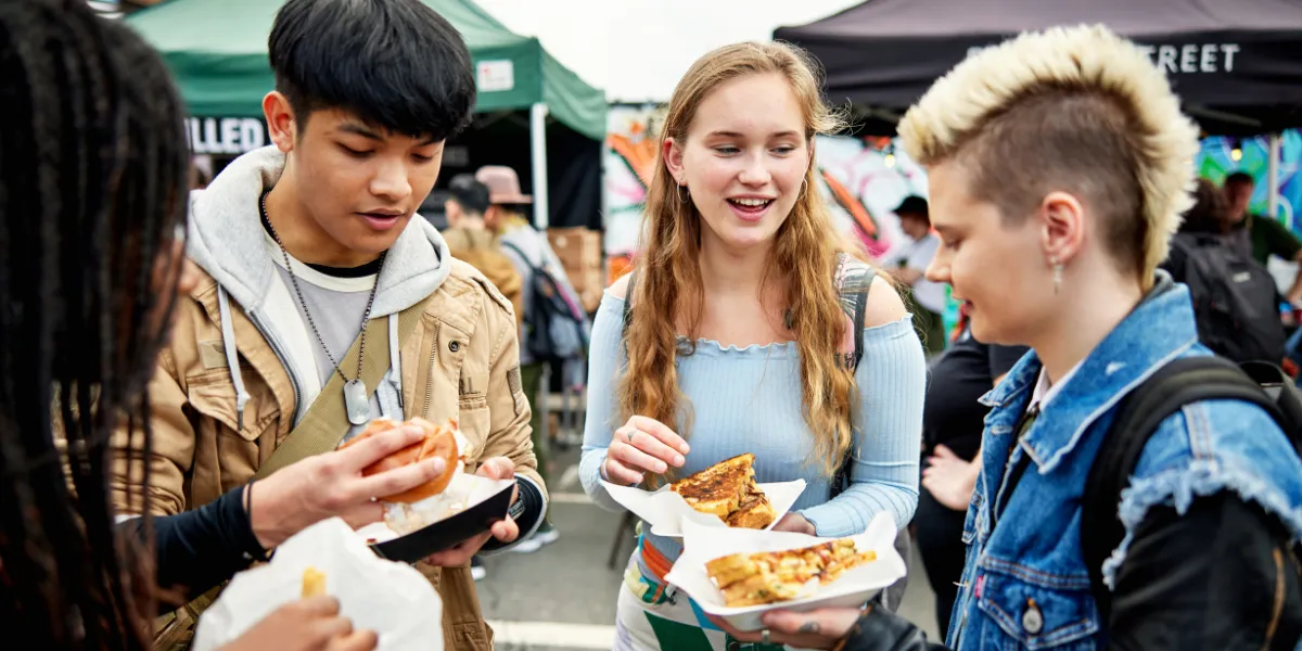 Gen Z traveller enjoying a local food festival in Vancouver