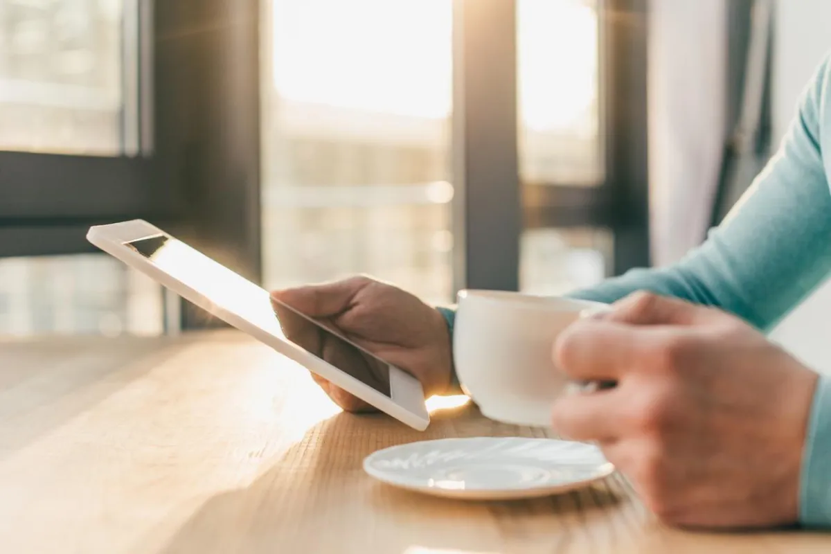 Realtor Sheila Howell With iPad and Coffee