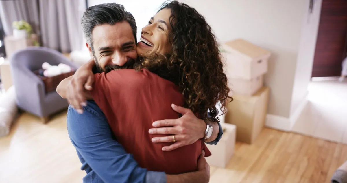 Homeowners celebrating after Sheila Howell helped simplify their home sale