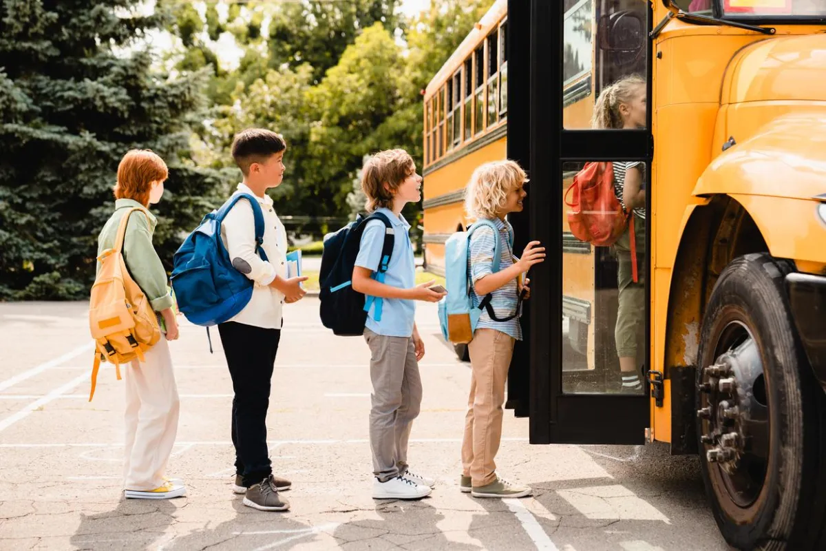 Group of Boys Getting on Schoool Bus in Central Ohio - Real Estate in New Albany