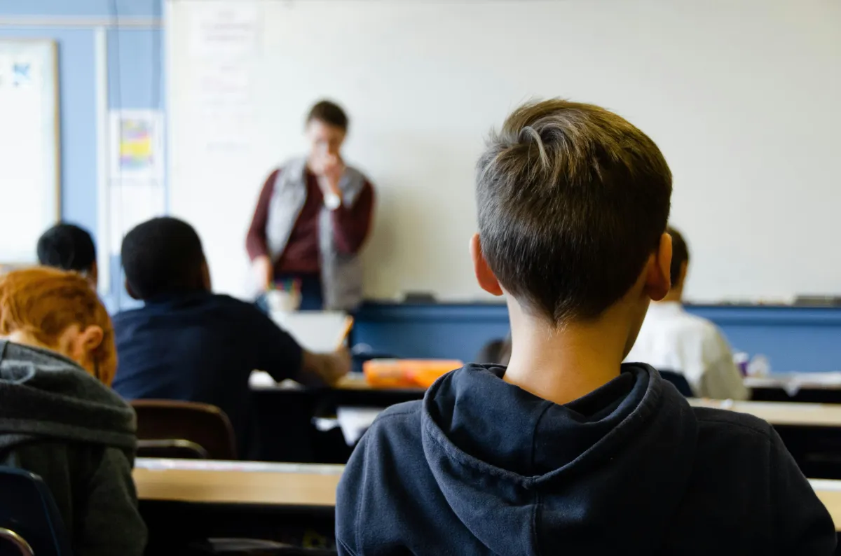 English teacher in classroom with students