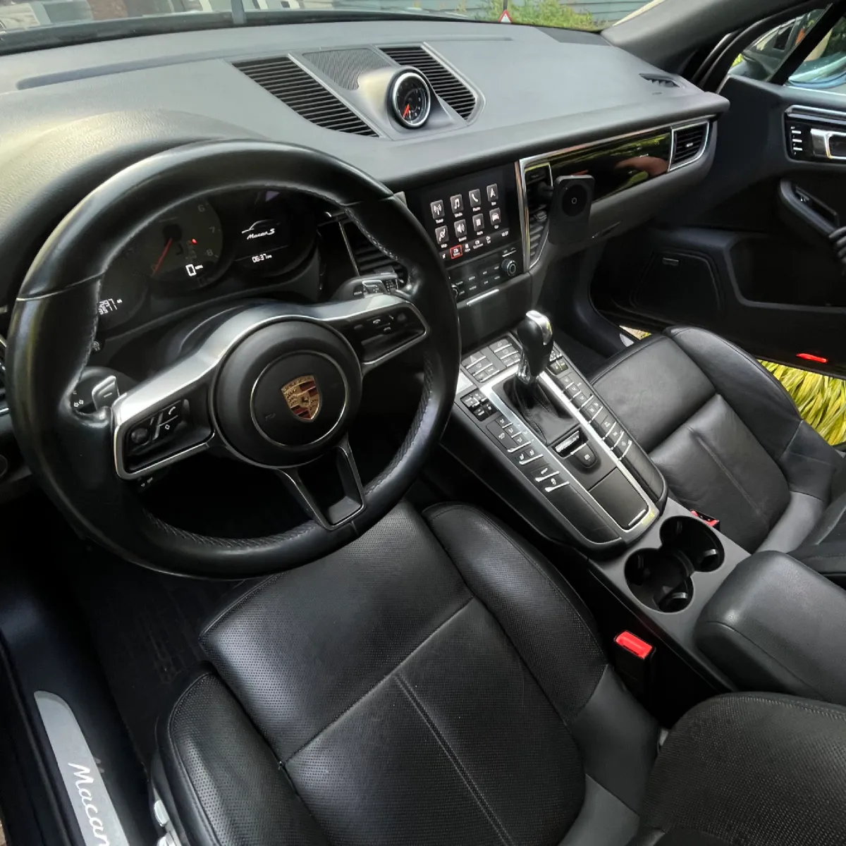 Detailed black car interior with polished leather seats
