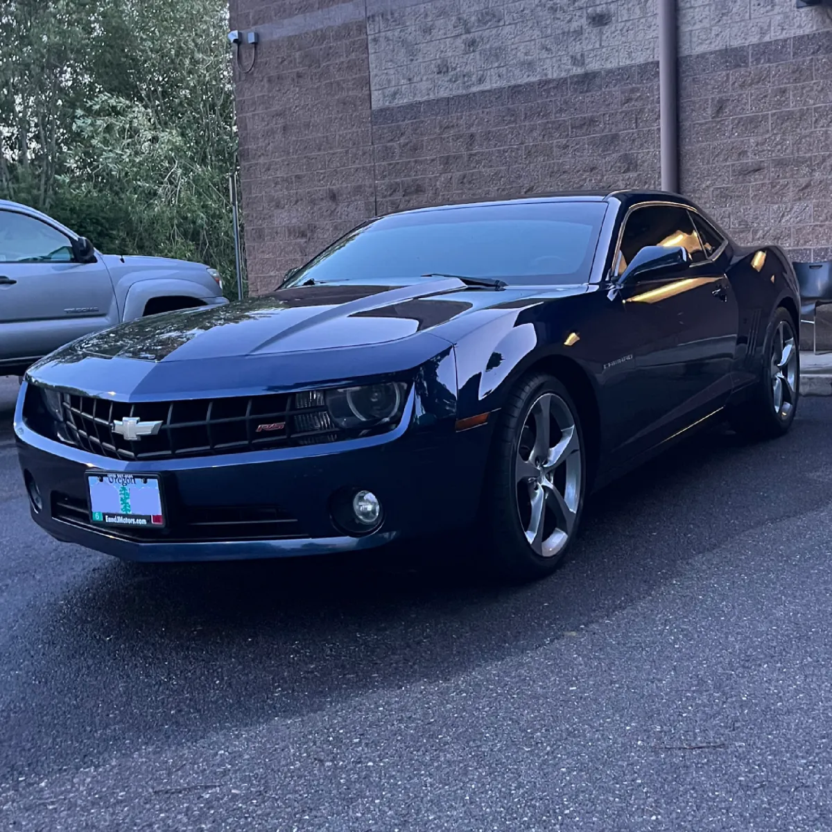 Blue sedan with gloss finish after car detail