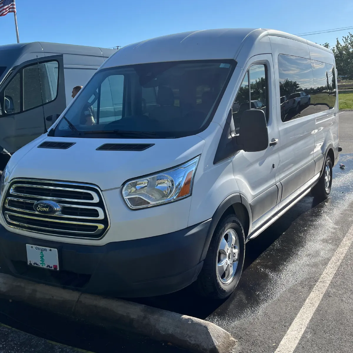 Detailed white Ford Transit van in Portland driveway