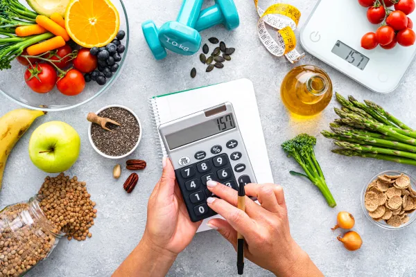 Lots of food being tracked with a calculator