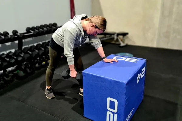 busy mum lifting weights