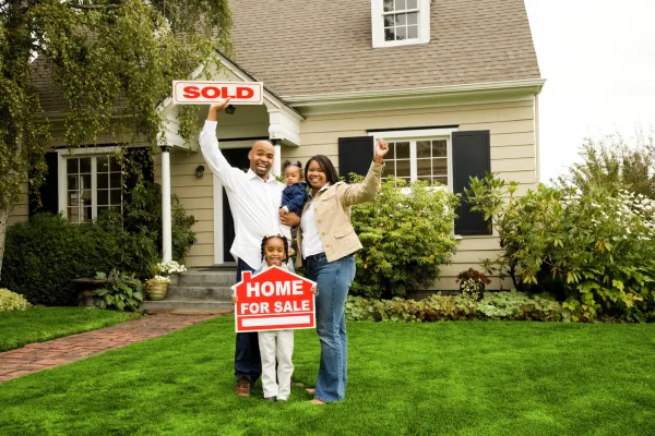 A happy family with sold home.