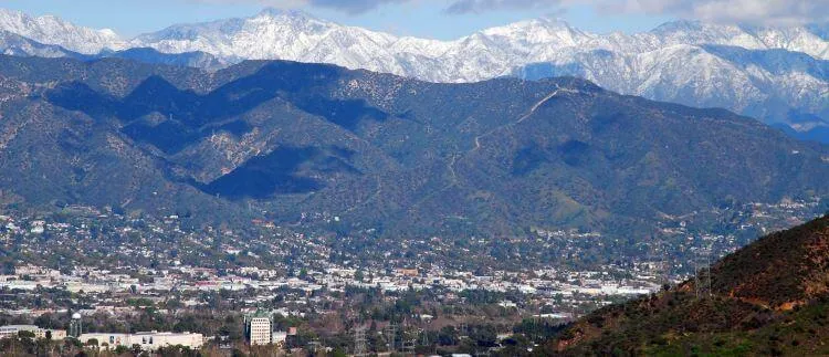 long view of the san gabriel valley with the mountains in the background