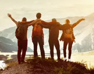 Friends with arms raised