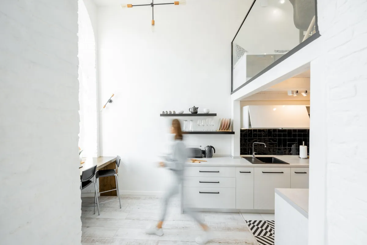 Woman walking in kitchen