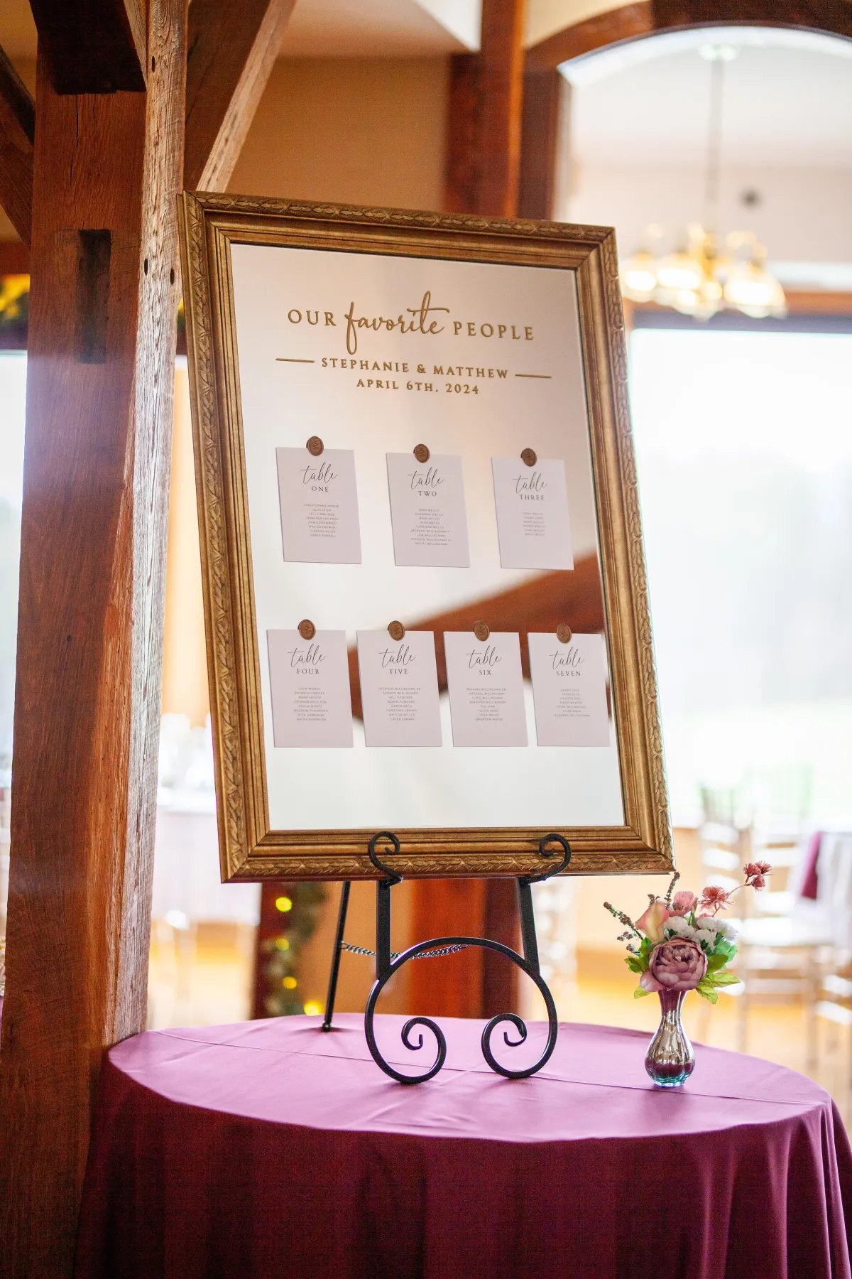 Mirror used as seating chart with cards for each table
