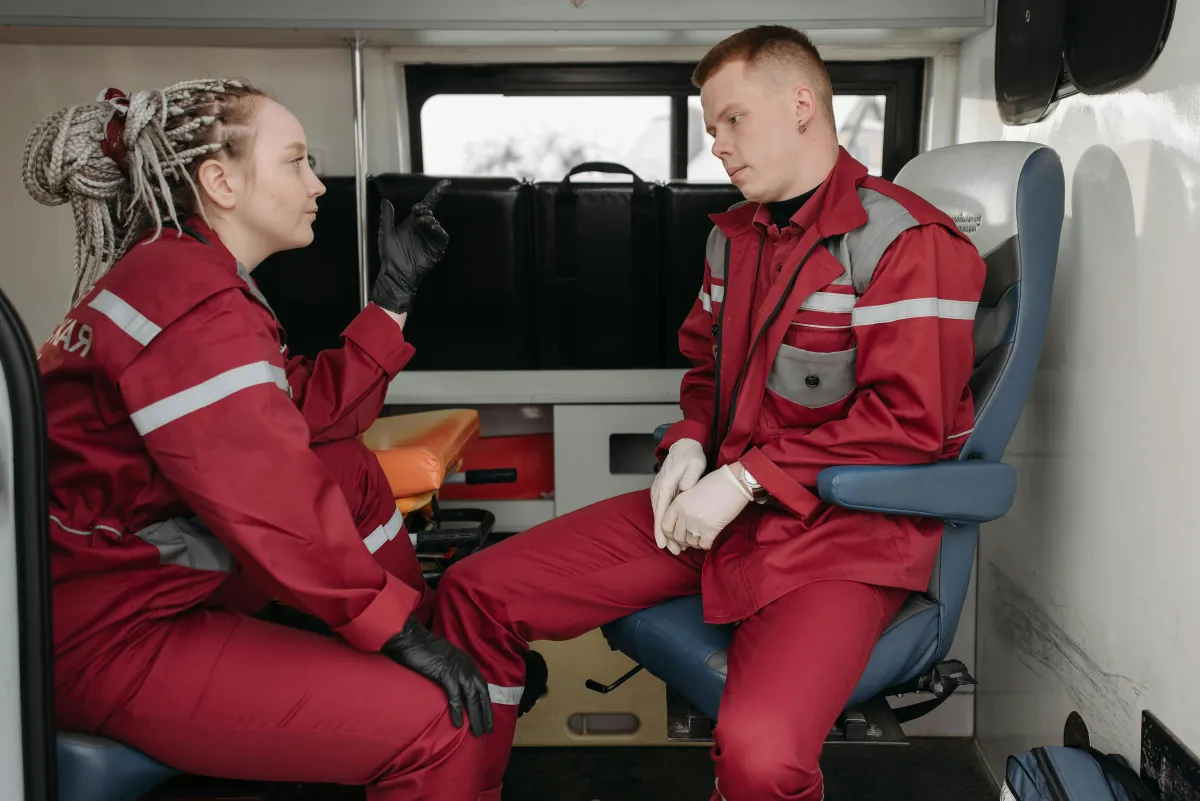 ambulance worker in car stock image
