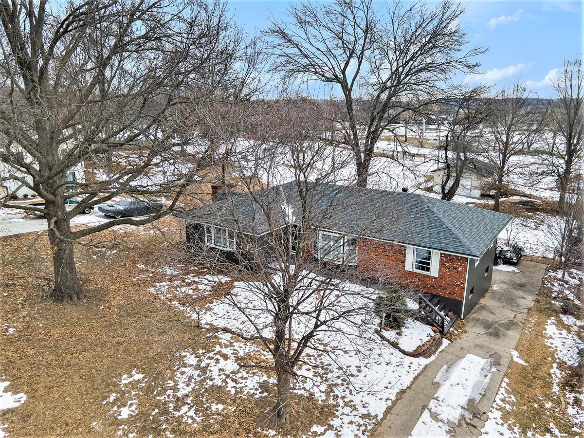 Picture of aerial view of home with golf course behind it
