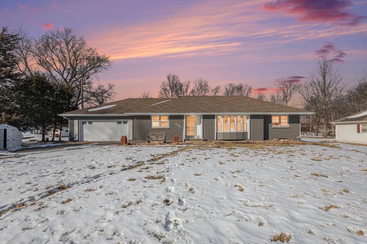 front of home with snow covered ground