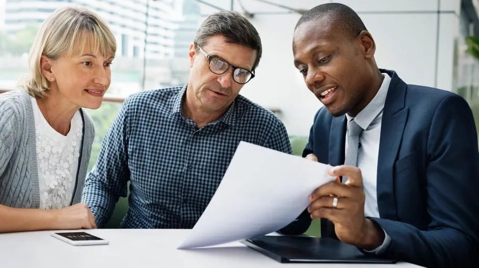 Couple discussing life insurance plans with Consultant to secure their financial future and protect their loved ones.