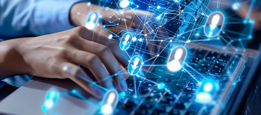 Close-up of hands typing on a laptop keyboard, overlaid with glowing digital connections and icons representing a network of human profiles, symbolizing the dynamic process of virtual recruiting and the expansive reach of online networking.