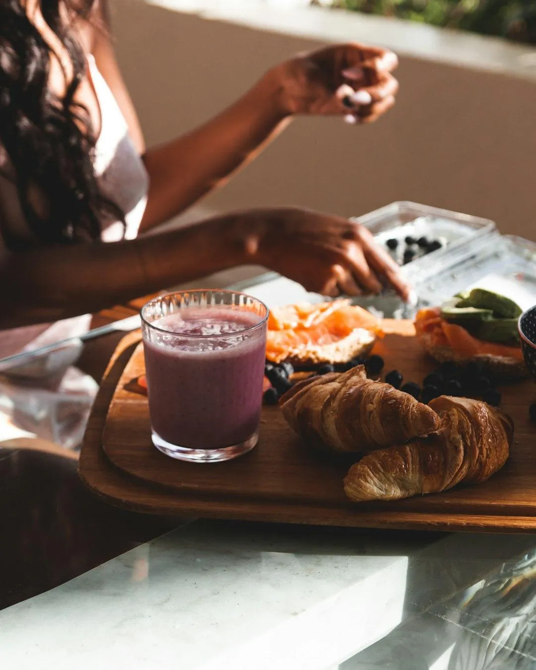 Woman sitting at table with a healthy breakfast