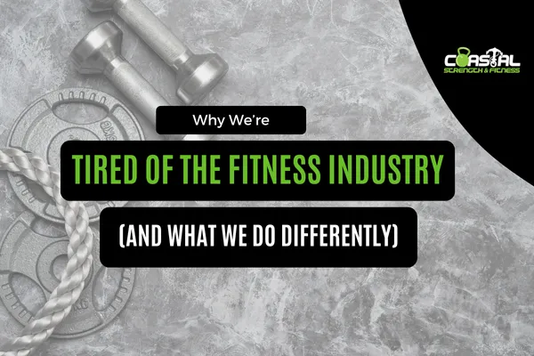 Digital cover image with gym equipment including dumbbells, weight plates, and a battle rope on a gray textured background. Bold text reads: 'Why We’re Tired of the Fitness Industry (And What We Do Differently)' with the Coastal Strength & Fitness logo in the top right corner.