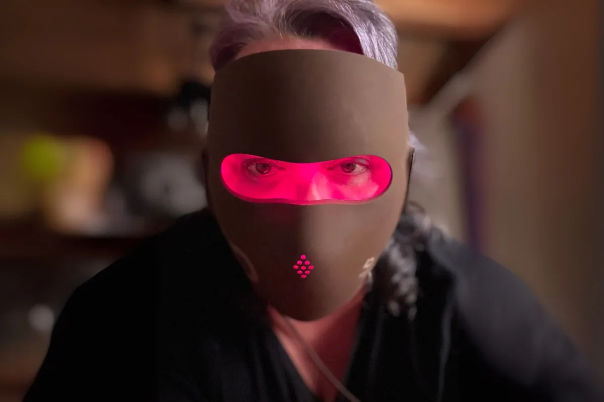Barbara wearing a red light therapy mask during her skincare routine, demonstrating at-home light therapy for healthy, glowing skin.