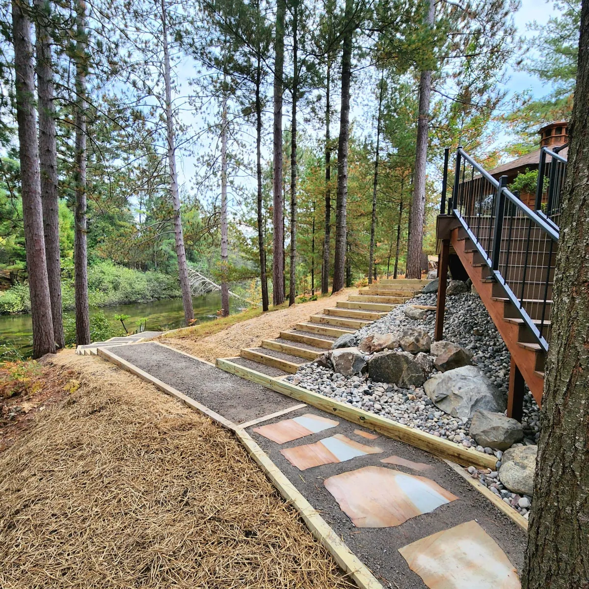 Beautiful stone pathway leading up to cabin stairs