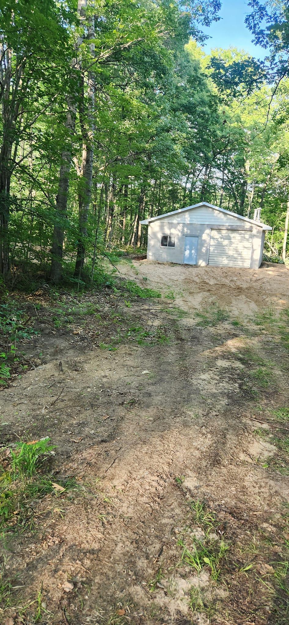 A rough and overgrown driveway in need of a fix