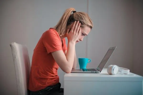 woman looking at laptop
