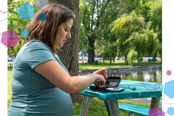 A pregnant woman with gestational diabetes testing her blood sugar at a park bench near Lister hospital, Stevenage.