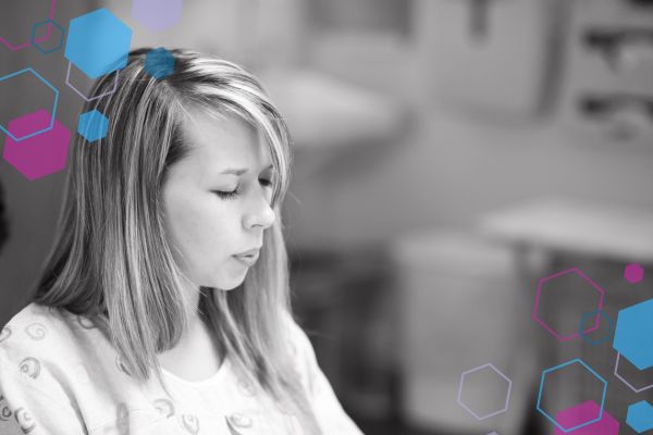 Labouring person breathing through a contraction with focused concentration, illustrating the kind of emotional support and calm environment doulas help create during labour.