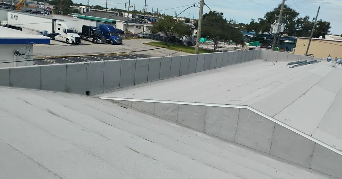 Commercial flat roof restoration near Range Road, Clearwater—CertainTeed Modified Torch Down, tapered drainage, code-compliant re-nailing, comprehensive flashing upgrades.