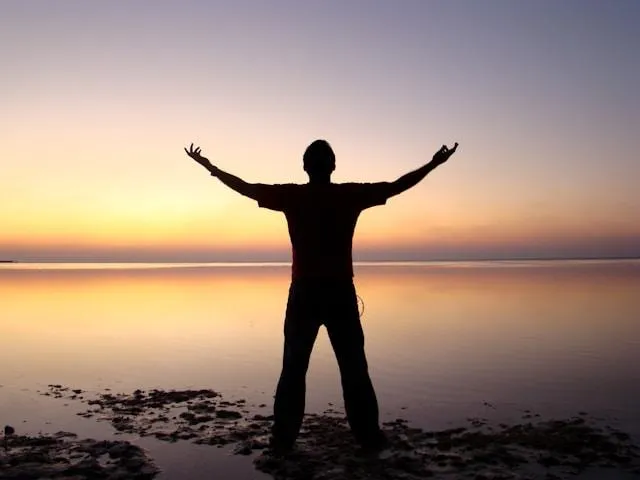 reiki healing for truma and stress man at a sunset