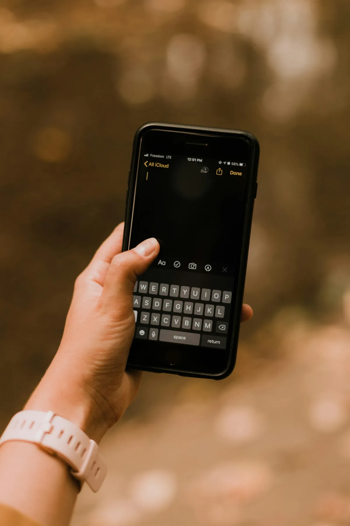 Person holding a cell phone
