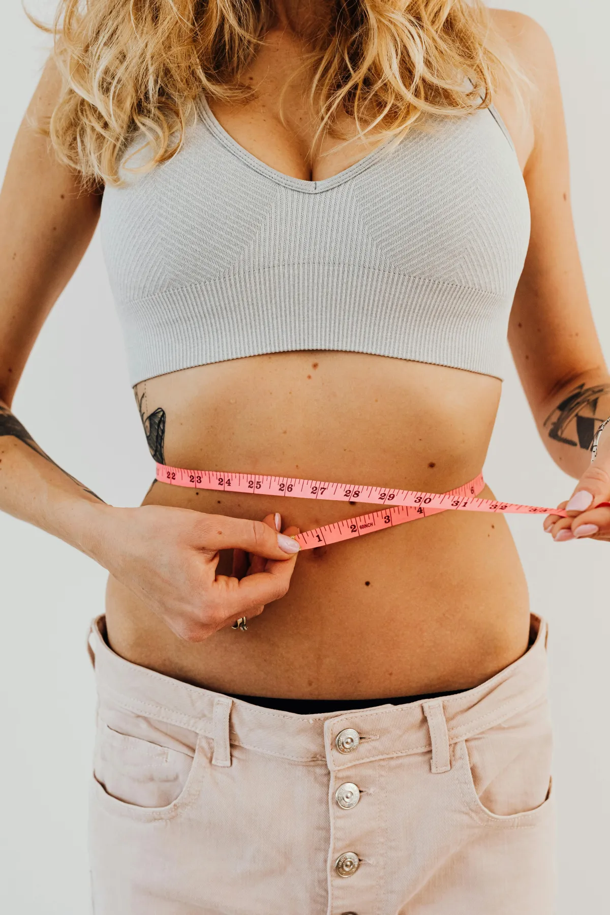 Woman measuring waist