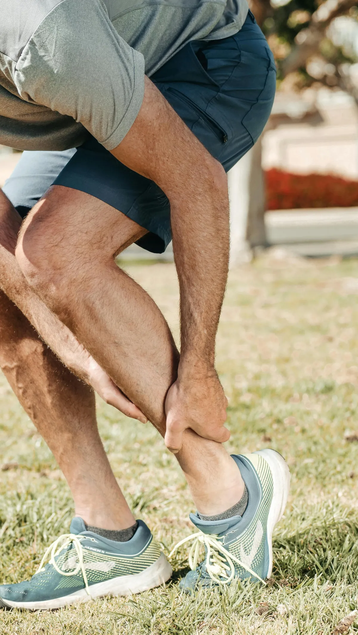 man holding leg