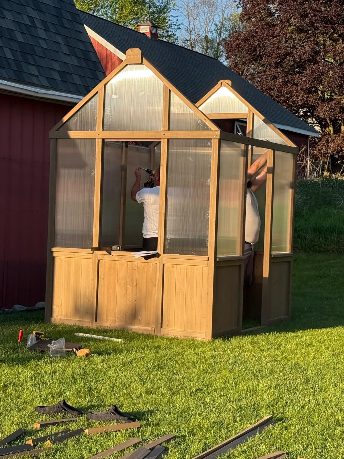 Building a backyard greenhouse from scratch, a visual metaphor for laying the foundation of a new business.