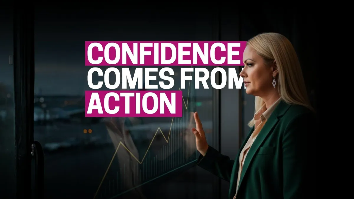 Stage backdrop at a conference featuring the phrase 'Sell Like a Girl' surrounded by bold floral designs, emphasizing feminine empowerment in business and sales.