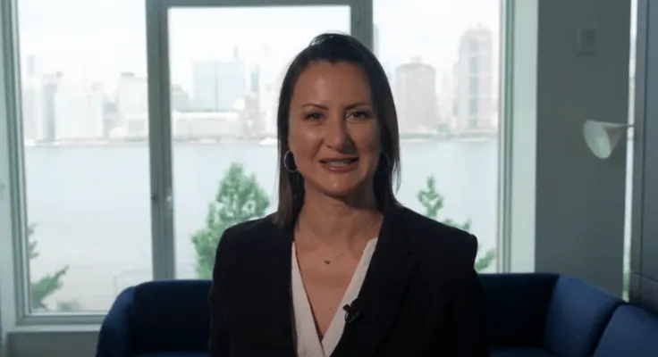 Francesca DeFranchis, founder of FS Event Staffing, smiling with the New York City skyline in the background.