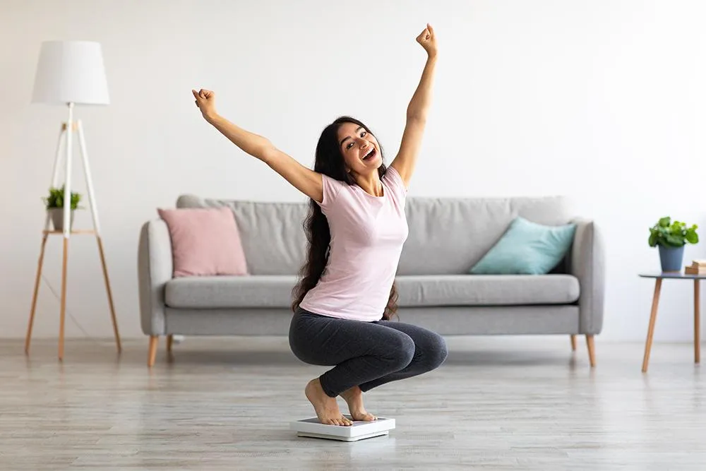 Woman Losing Weight On Scale