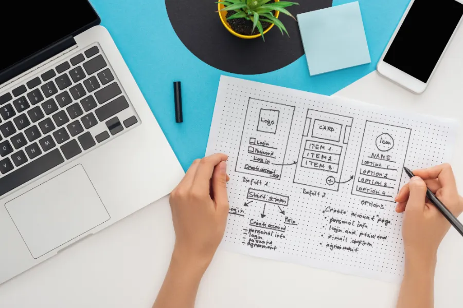 Web designer at his desk planning a content strategy for his new website build.