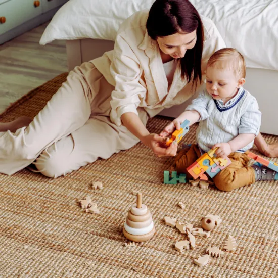 Mother playing blocks with infant