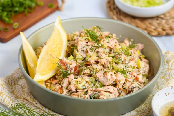 High-protein salmon salad with Greek yogurt, lemon, and dill, a healthy meal for athletes focused on recovery and performance.