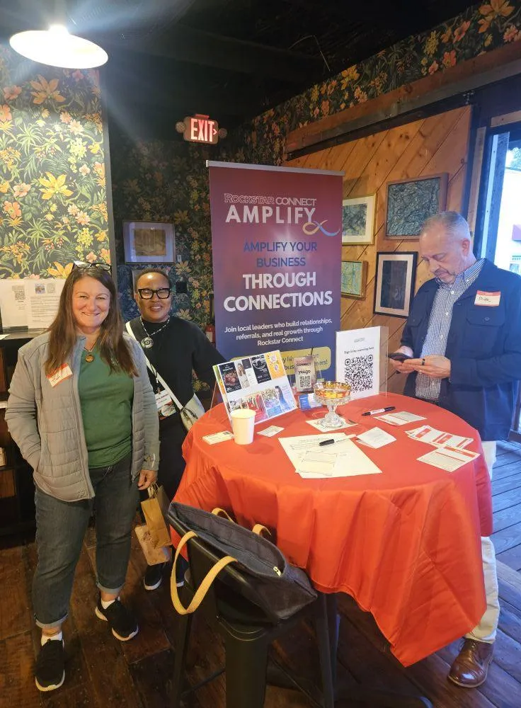Local business owners networking at a community event in Durham, NC, showcasing relationship-driven networking beyond traditional business meetings.