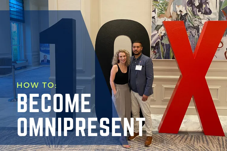 Man and woman in front of a 10X sign