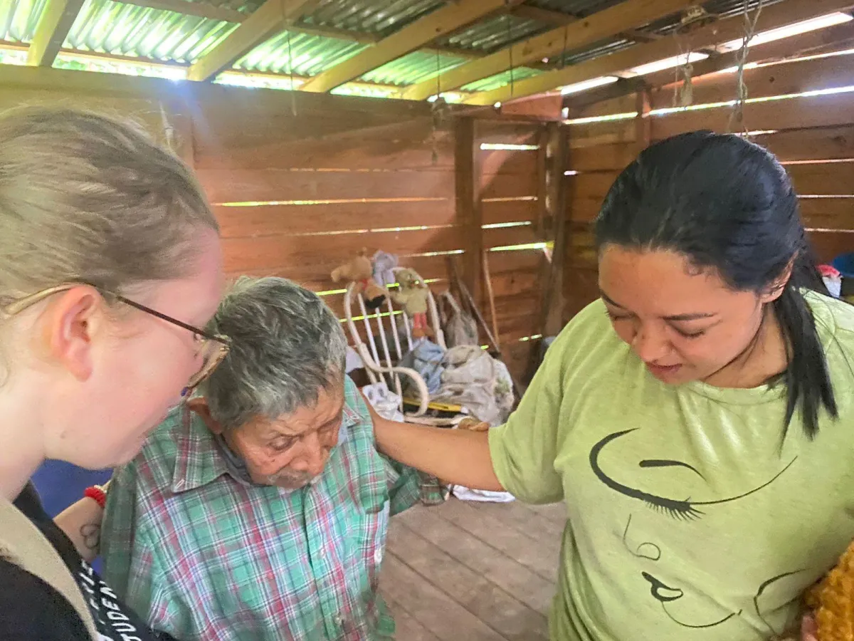 Praying with man who recieved a house.