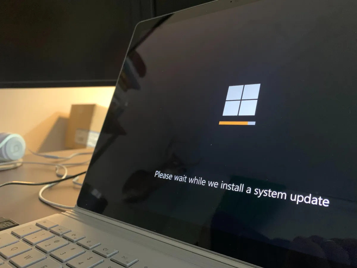 Close up of a Windows laptop installing a system update.